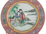 a plate with a picture of two people on it