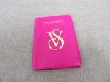 a close up of a passport sitting on top of a table