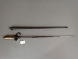 pair of old swords on a table with tags attached to them