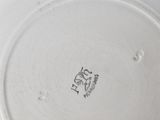 a white plate with a black design on it