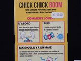 a box of chick chick boom next to a box of candy