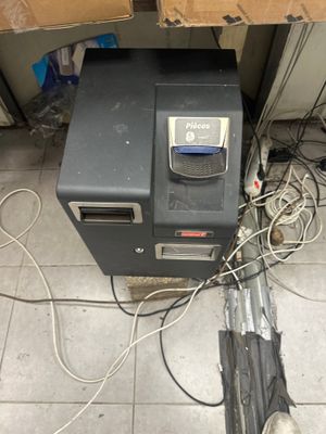 a small machine that is on the floor next to a pile of wires