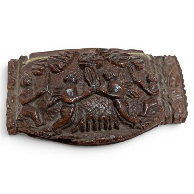 a belt buckle with a picture of a man and a dog on it