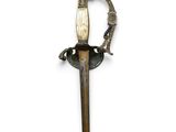 an old sword with a wooden handle on a white background