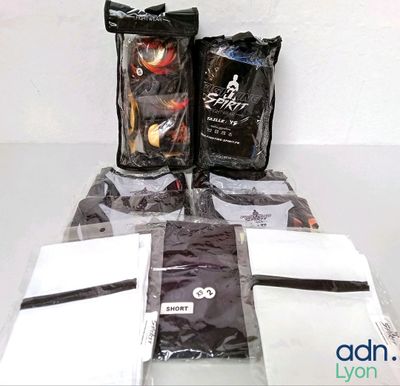 several bags of coffee sit on a table next to a bag of coffee