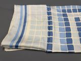 a close up of a blue and white towel on a table