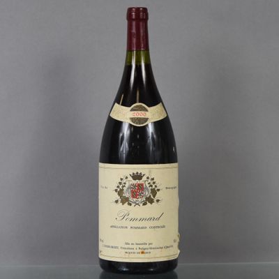 a bottle of wine sitting on top of a glass table