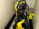 a yellow and black pressurer sitting on the floor next to a door