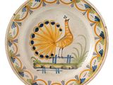 a plate with a bird painted on it