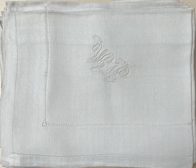 a close up of a napkin with a monogram on it