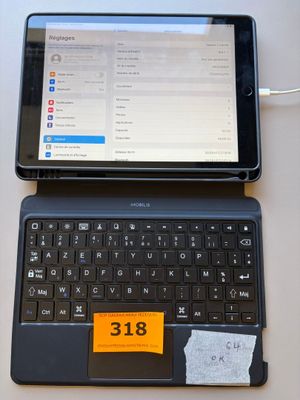 a laptop computer sitting on top of a table next to a tablet computer