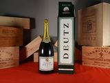 a bottle of wine and a box of wine on a table