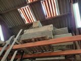 several pieces of wood are stacked on top of each other in a building