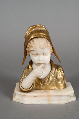 an image of a statue of a boy with a hat on his head
