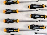 six screwdrivers are lined up in a row on a table
