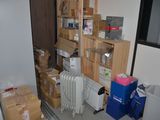 a room with a lot of boxes and a radiator