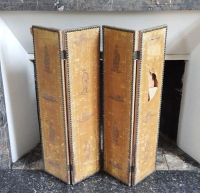 pair of antique suitcases on display in front of a fireplace