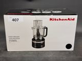 packaging of a kitchenaid food processor in a box on a table
