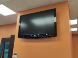 a flat screen tv mounted on the wall in a room