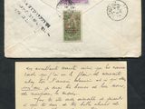 an old envelope with a stamp on it sitting next to an envelope with a stamp on it