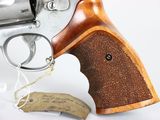 the revolver is made of wood and has a wooden handle