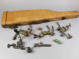 a group of old tools and a wooden case on a table