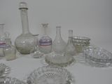 a lot of glass vases and other glass items on the table