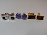 three pairs of cufflinks with purple and blue enamel