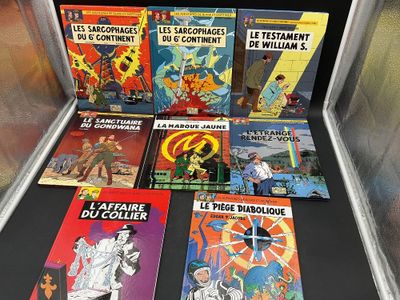 a lot of comics on display in a display case