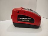 black and decker mini station battery charger on a white surface