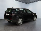 a black car that is parked inside of a building