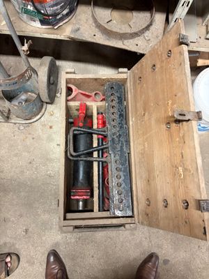 a person standing in a room with tools in it