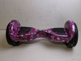 a purple hoveboard that is sitting on a table