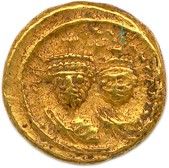 une pièce d'or sur laquelle est représentée la tête d'une femme