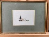 framed picture of a cat laying on the ground in a wooden frame