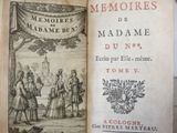 an open book with a picture of a man and woman in a garden