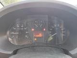 a close up of a car dashboard with a speedometer