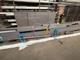 many pieces of steel sitting in a warehouse