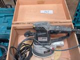 a box with a sander and other tools in it