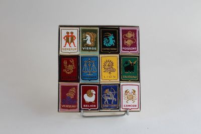 an image of a box of matchboxes on a white surface