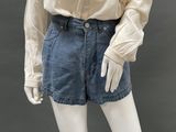 an image of a mannequin wearing a white shirt and denim shorts