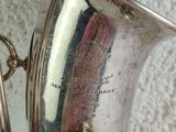 a silver instrument that is sitting on a table