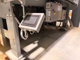 an image of a machine with a tablet on it