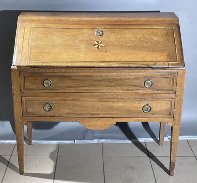 an old wooden desk with three drawers on top of it