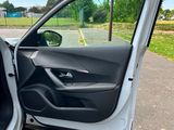 a close up of a car door with the door open