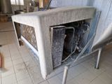 une photo d'un vieux poêle dans une cuisine