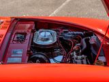 a close up of a red car with its hood open