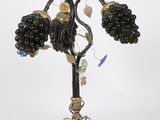 a close up of a lamp with a bunch of beads on it