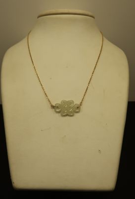 a close up of a necklace on a mannequin neck