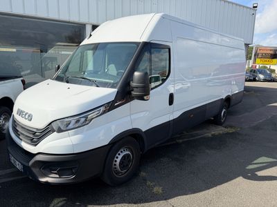 a picture of a white van parked in front of a building